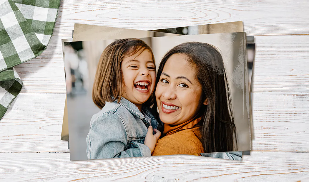 ["Photo Prints from Printerpix", "Stack of personalized photo prints from Printerpix online photo service", "Small, medium, and large photo prints on the table from the mobile phone", "Photo prints", "Hands holding a photo print of three children on holiday", "Various sizes of online photo prints from mobile phone photos of the family", "", "", "", ""]||||||||||