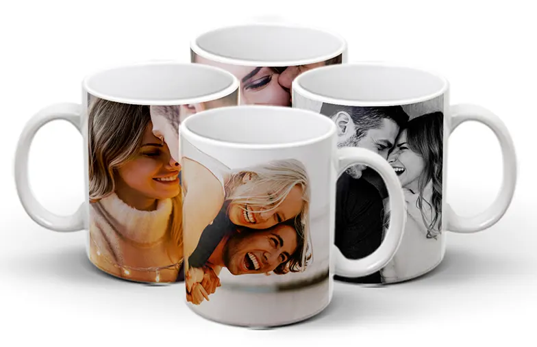 ["Personalised Photo Mugs from Printerpix", "Mum and baby holding a Printerpix mug with cartoon design and 'Dad' text", "Personalised photo mug with picture of a crawling baby in an animal onesie", "Mum and daughter holding custom photo mugs with family photos", "Kissing couple with personalised mugs with text", "Personalised photo mug with your own photo of a dog on it", "", "", "", ""]||||||||||